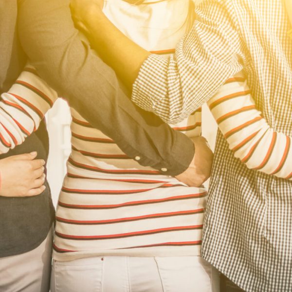Unity and teamwork concept. Creative team meeting hands together in line. Young business people are holding hands. Unity and teamwork concept.